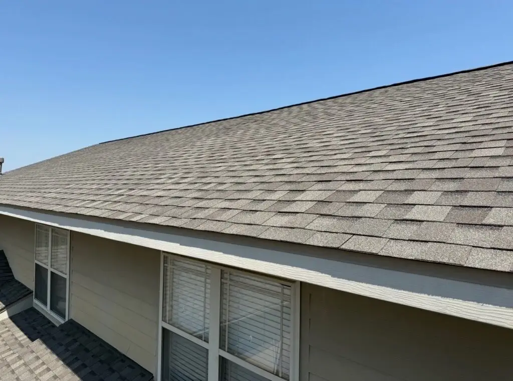Photo of a repaired shingle roof in Fayetteville AR courtesy of RoofCo NWA.