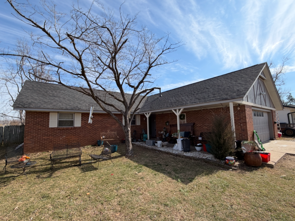 A newly replaced shingle roof from a home serviced by RoofCo NWA in Lowell AR.